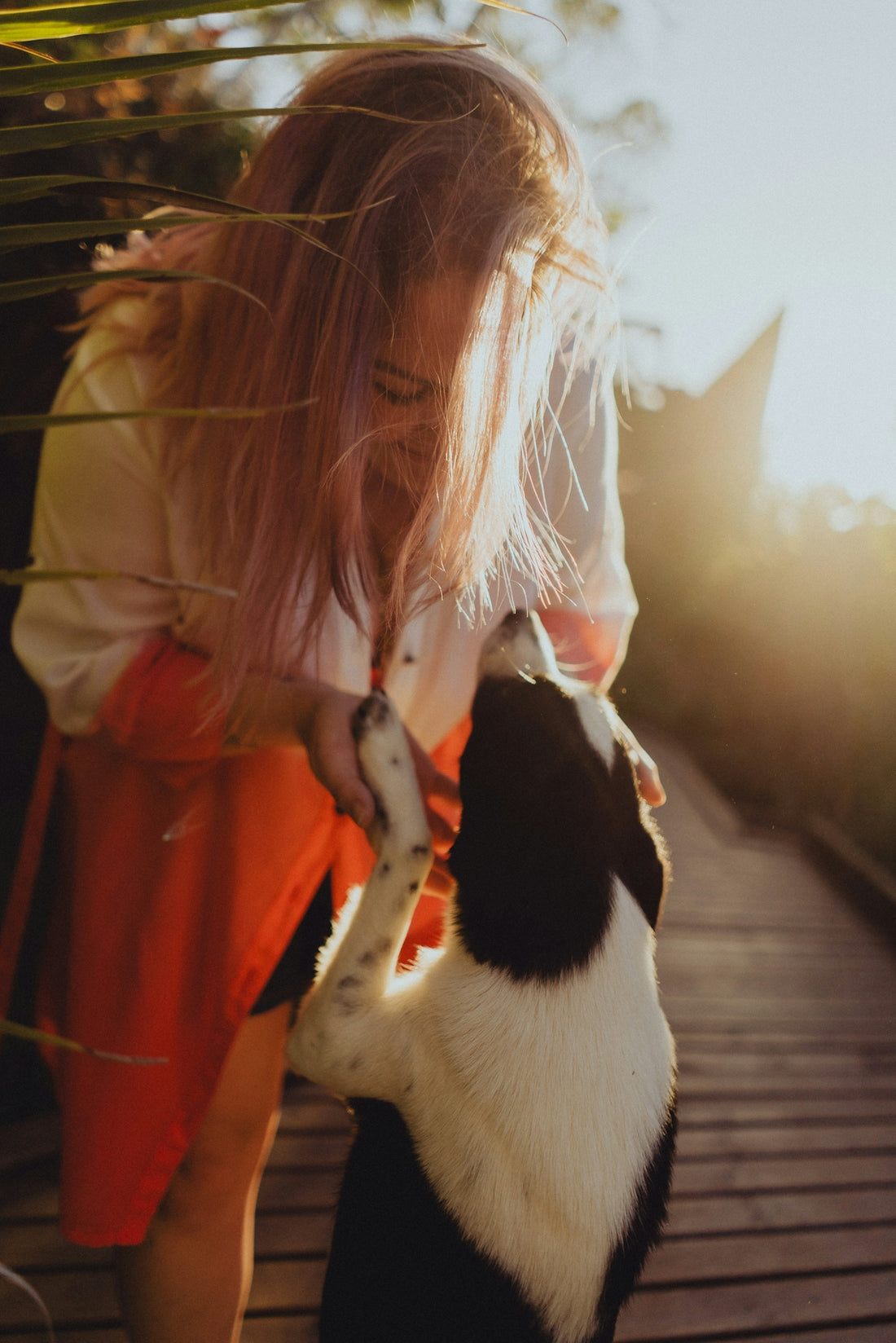 a woman holding a bird